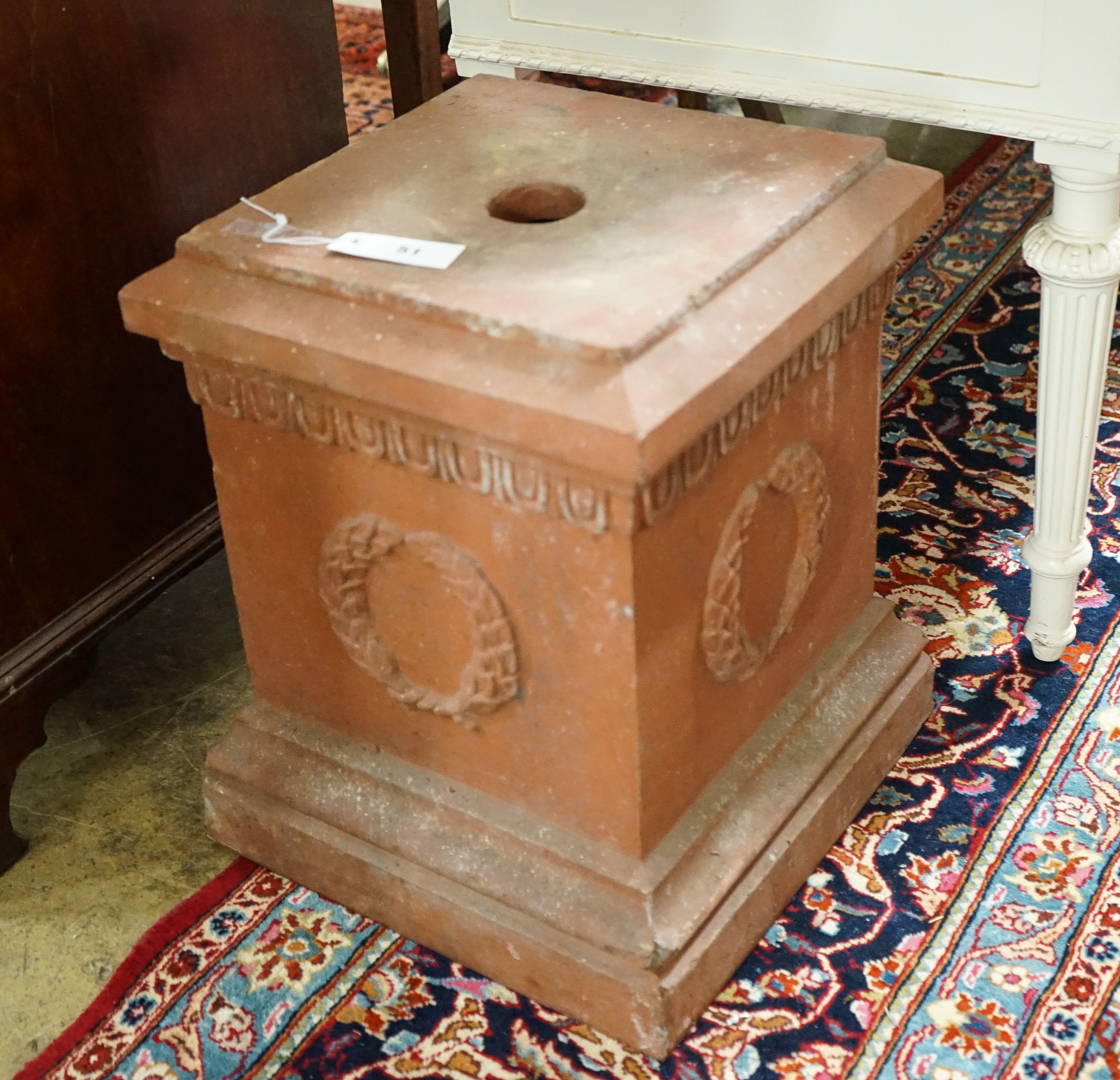 A square terracotta garden plinth, width 35cm, height 46cm